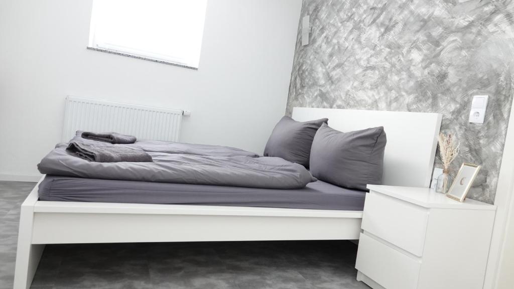 En eller flere senge i et værelse på Casa Mia