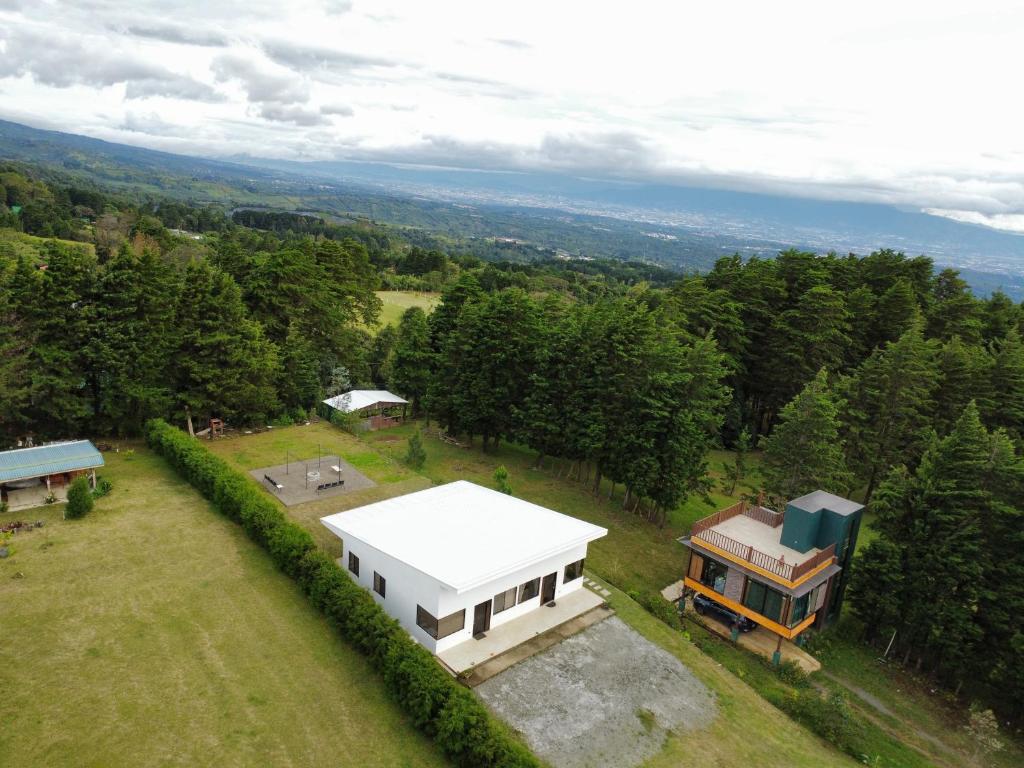 an aerial view of a house in a field at Residencial de montaña Los Quetzales in Poás