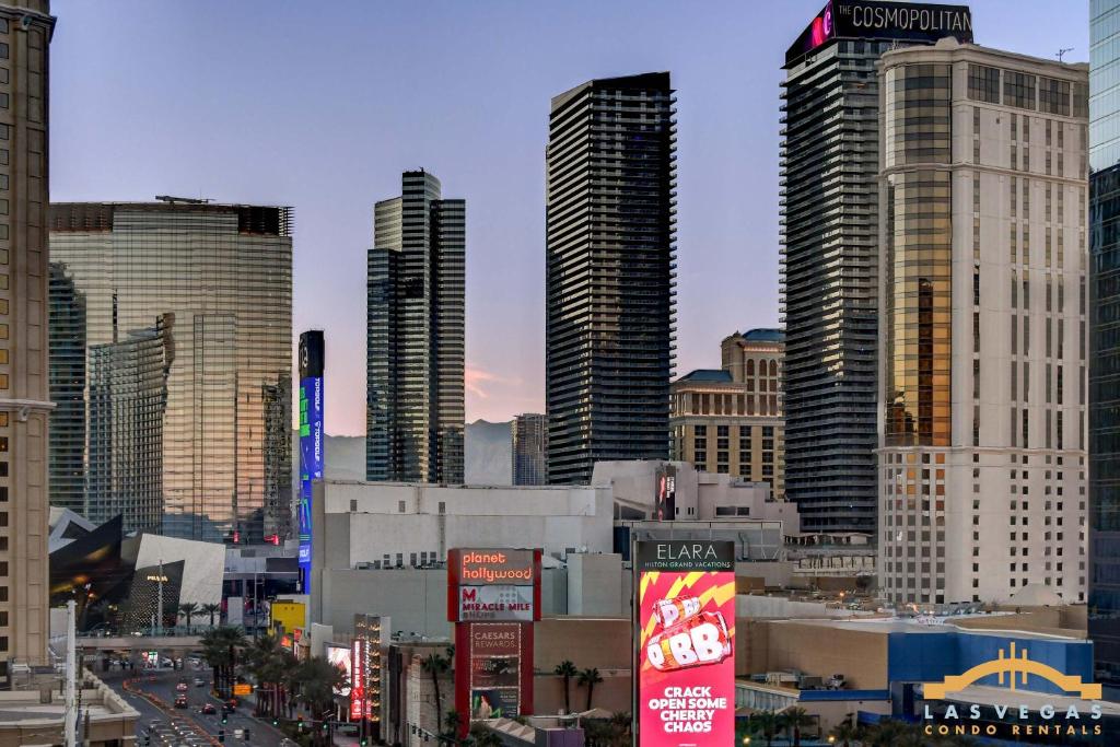 a city skyline with skyscrapers in a city at MGM Signature-09-821 1Br2Ba F1 Strip View Balcony Suite in Las Vegas