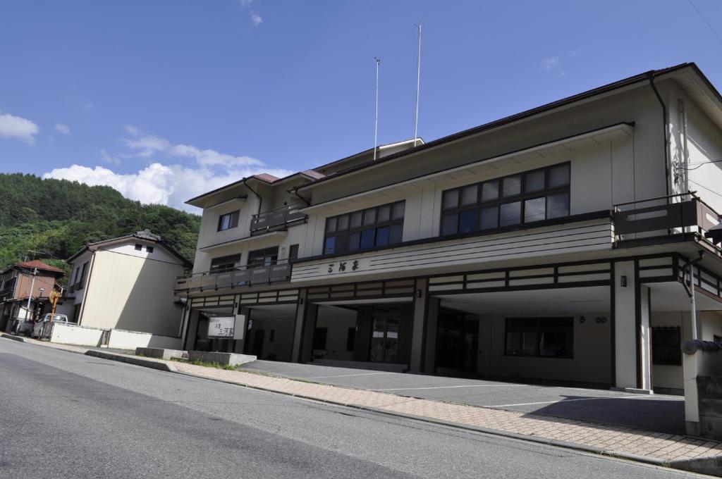 a building on the side of a street at Kiso Mikawaya in Kiso