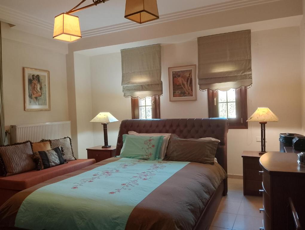 En eller flere senge i et værelse på Villa Marga Luxury Retreat