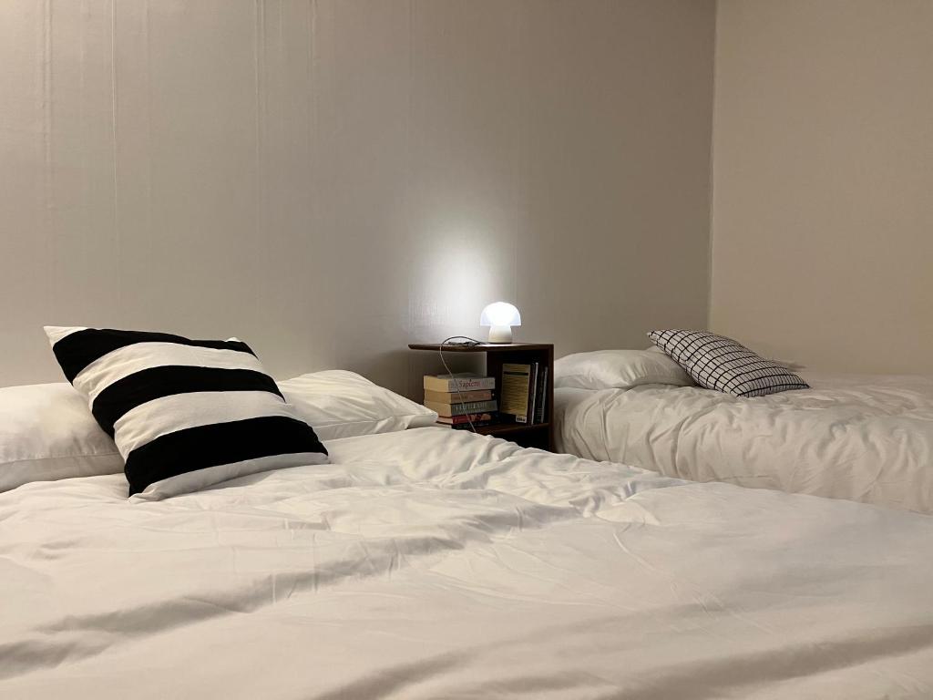 En eller flere senge i et værelse på Nangok Sillim KyungIn Edu Seoul National University Sindaebang