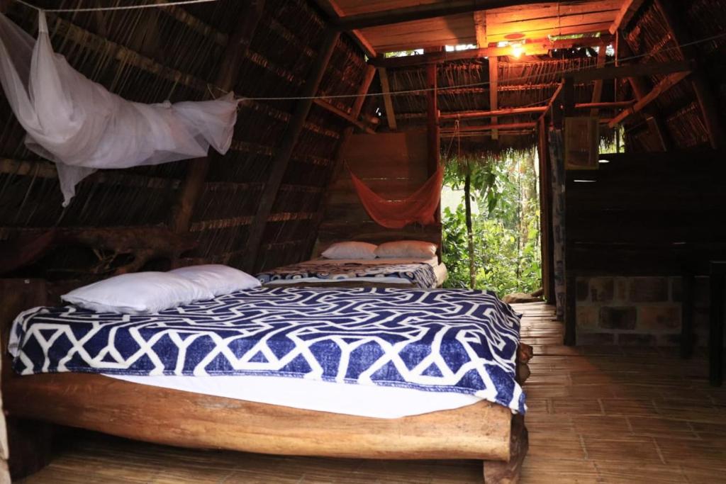 Postel nebo postele na pokoji v ubytování Amanecer mágico, Putumayo