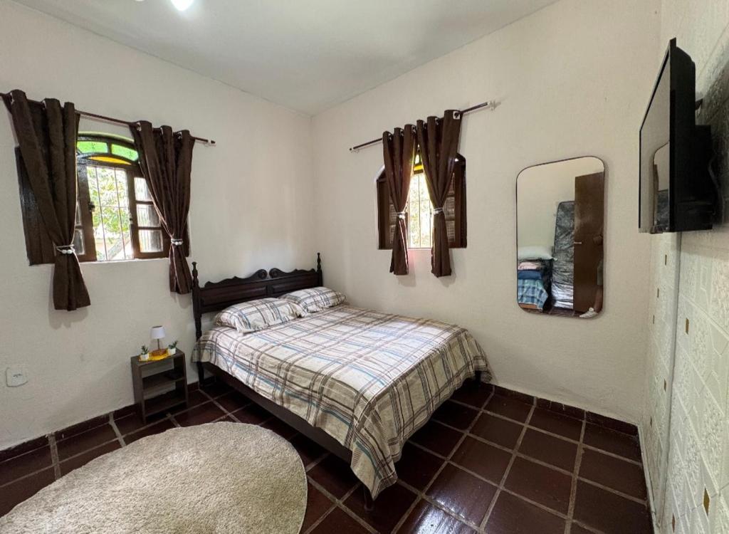 Кровать или кровати в номере Sítio Paulinha e Rodrigão Classic bodybuilder