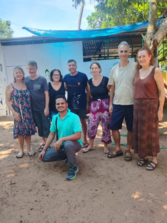 a group of people posing for a picture at iha ayurveda resort in Varkala