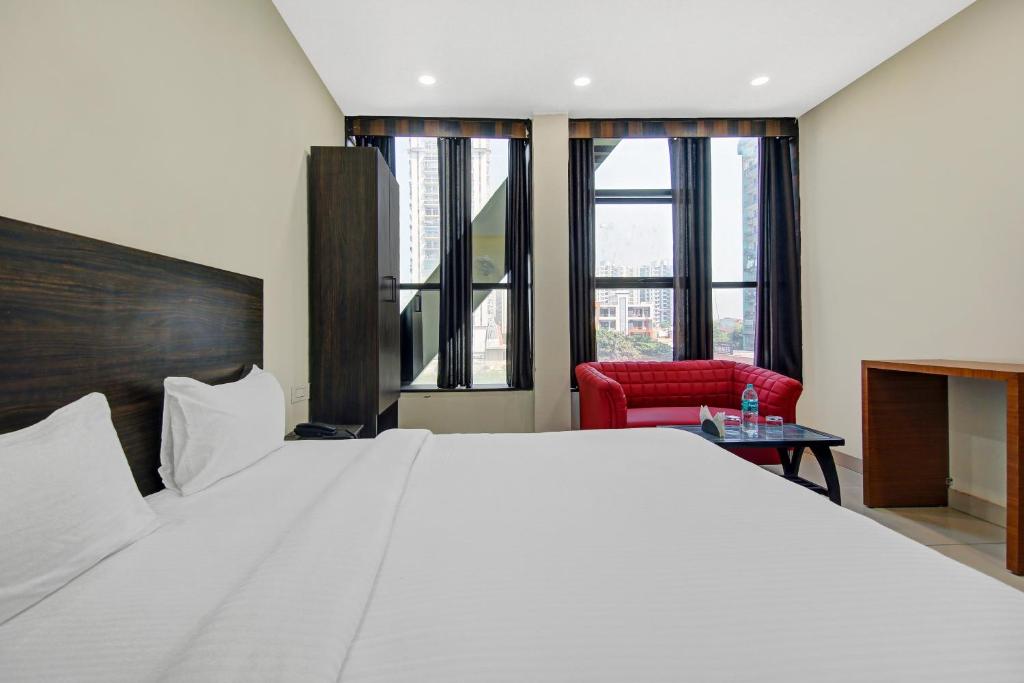 En eller flere senge i et værelse på Hotel O Kinsfolk Inn