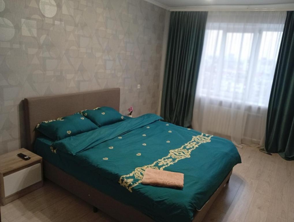 מיטה או מיטות בחדר ב-2 bedroom Puskin