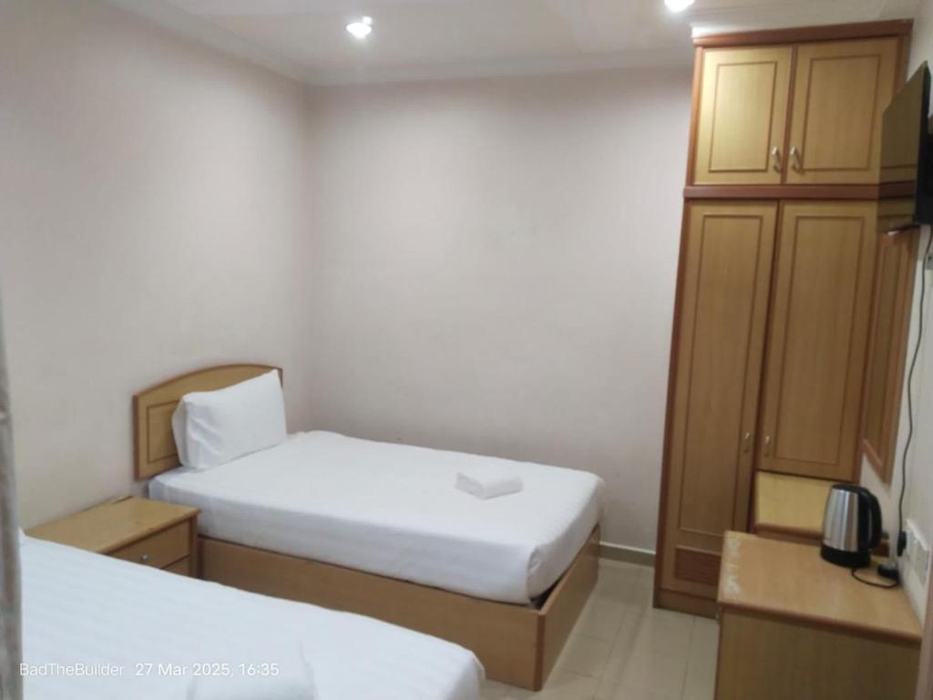 Ένα ή περισσότερα κρεβάτια σε δωμάτιο στο BBHotel