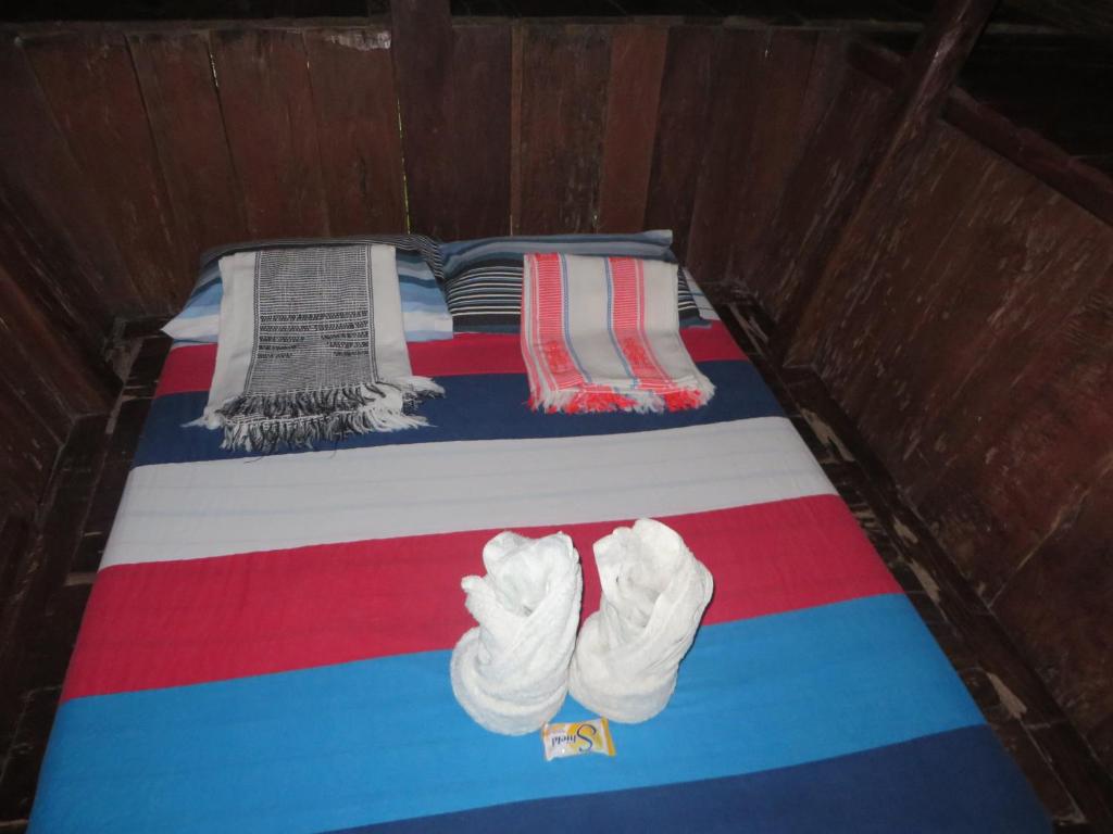 Postel nebo postele na pokoji v ubytování Native Village Inn