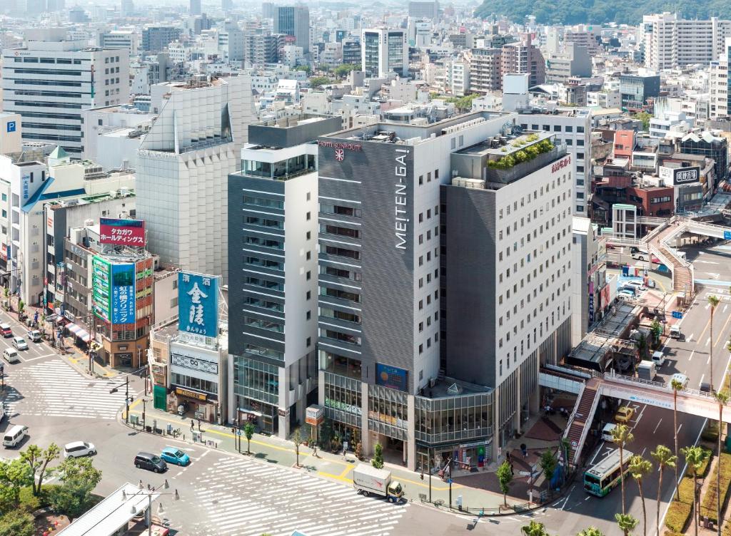 uma vista aérea de uma cidade com edifícios altos em Hotel Sunroute Tokushima em Tokushima