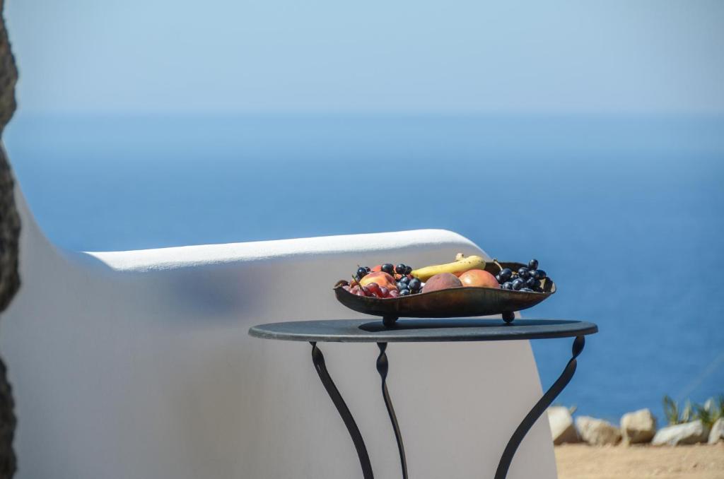 a bowl of fruit sitting on a table at Casa Borealis in Naxos Chora