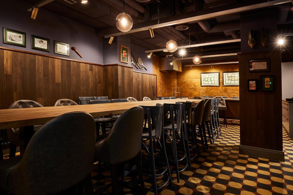 a conference room with a long table and chairs at Boutique Hotel Spedition a member of DESIGN HOTELS in Thun