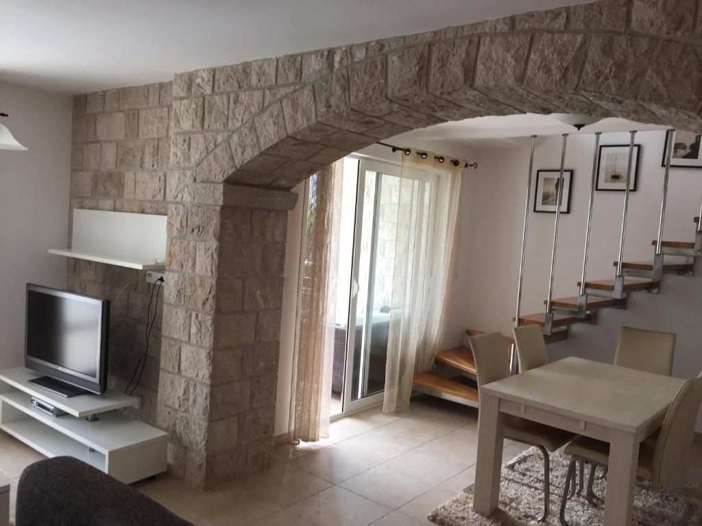 TV a/nebo společenská místnost v ubytování Muo Apartments