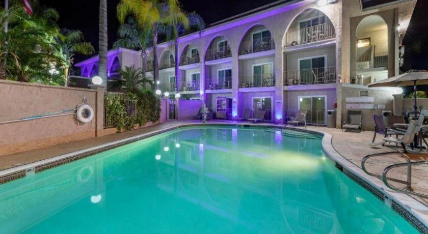 a swimming pool in front of a building at night at Comfort Inn Escondido San Diego North County in Escondido
