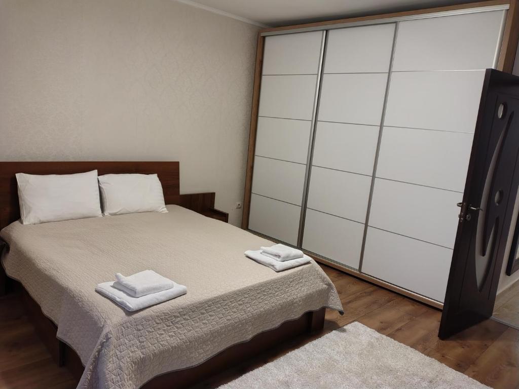 Giường trong phòng chung tại Class Apartments