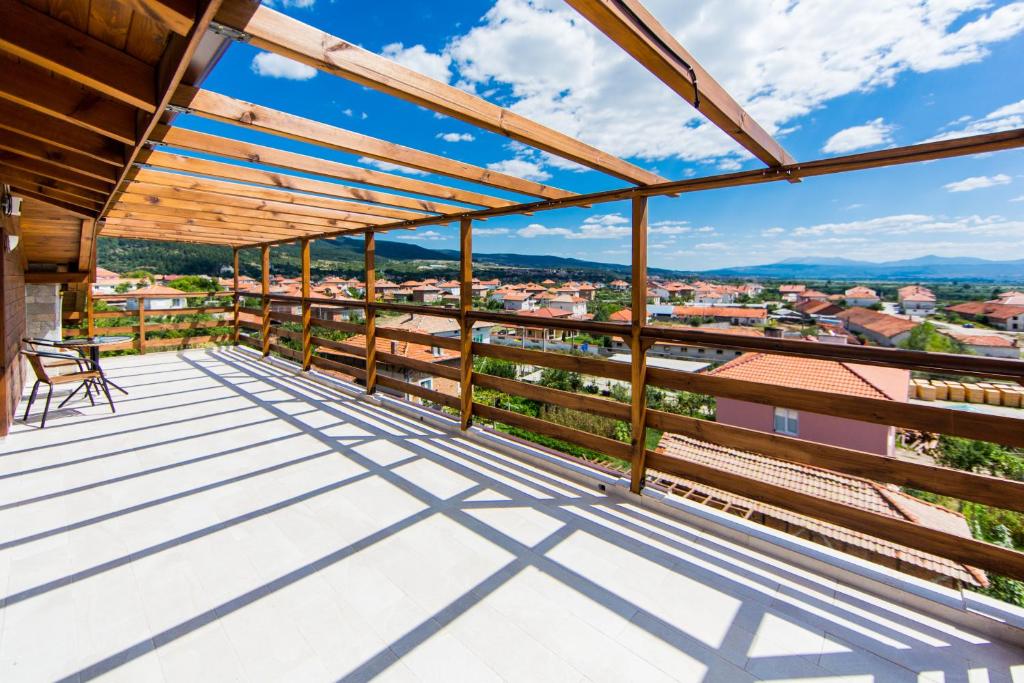 a balcony with a view of a city at Guest House Ognyanovo in Ognyanovo