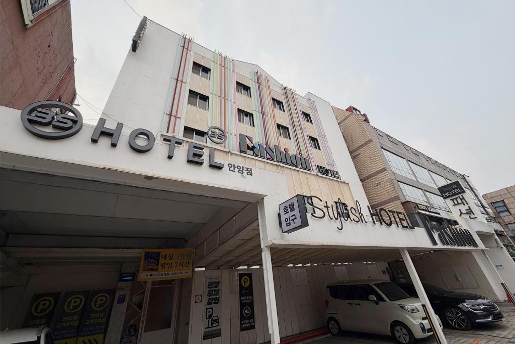 a building with a car parked in front of it at 3S HOTEL ANYANG 1st FASHION in Anyang
