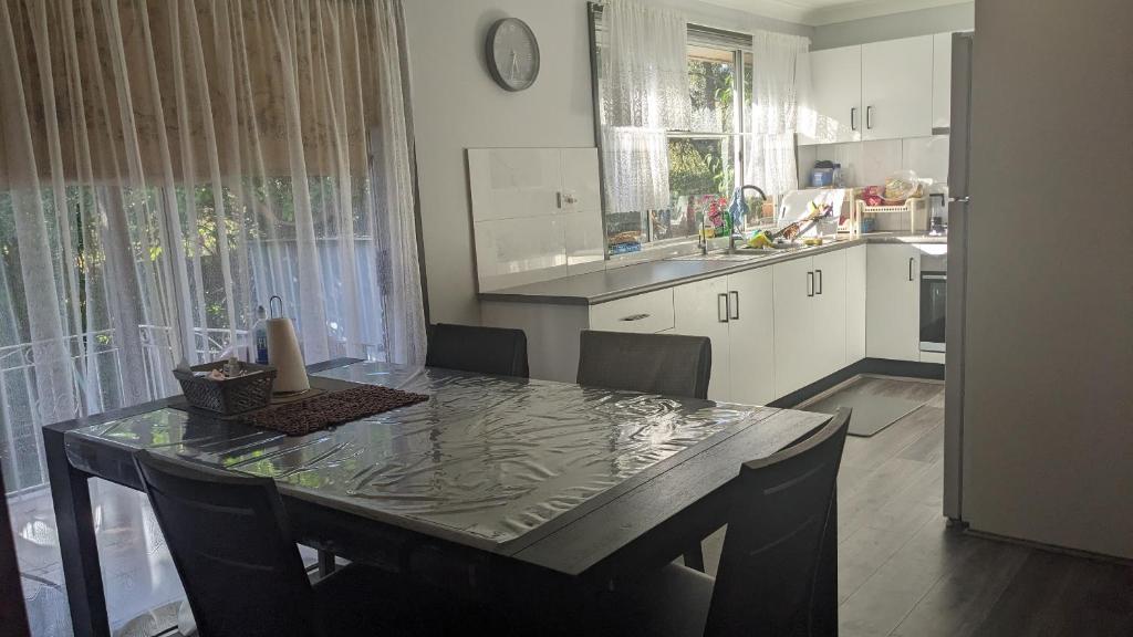 a kitchen with a table with a candle on it at Bidwill Garden in Bidwill