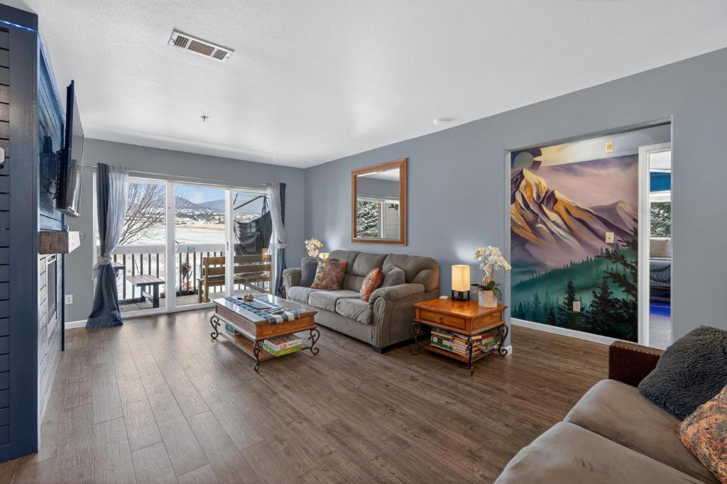 a living room with a couch and a table at New Castles Kings N Queens 14mins to Glenwood Springs in New Castle