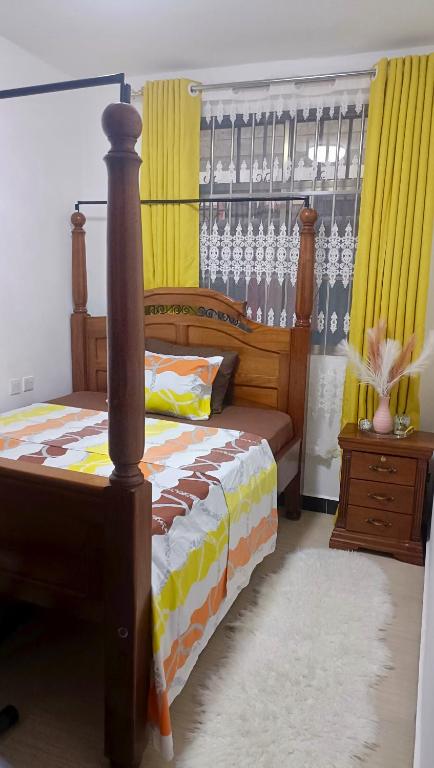 Ένα ή περισσότερα κρεβάτια σε δωμάτιο στο Pambazuka home