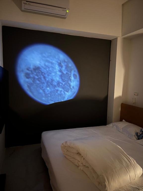 Postel nebo postele na pokoji v ubytování 5920電梯民宿