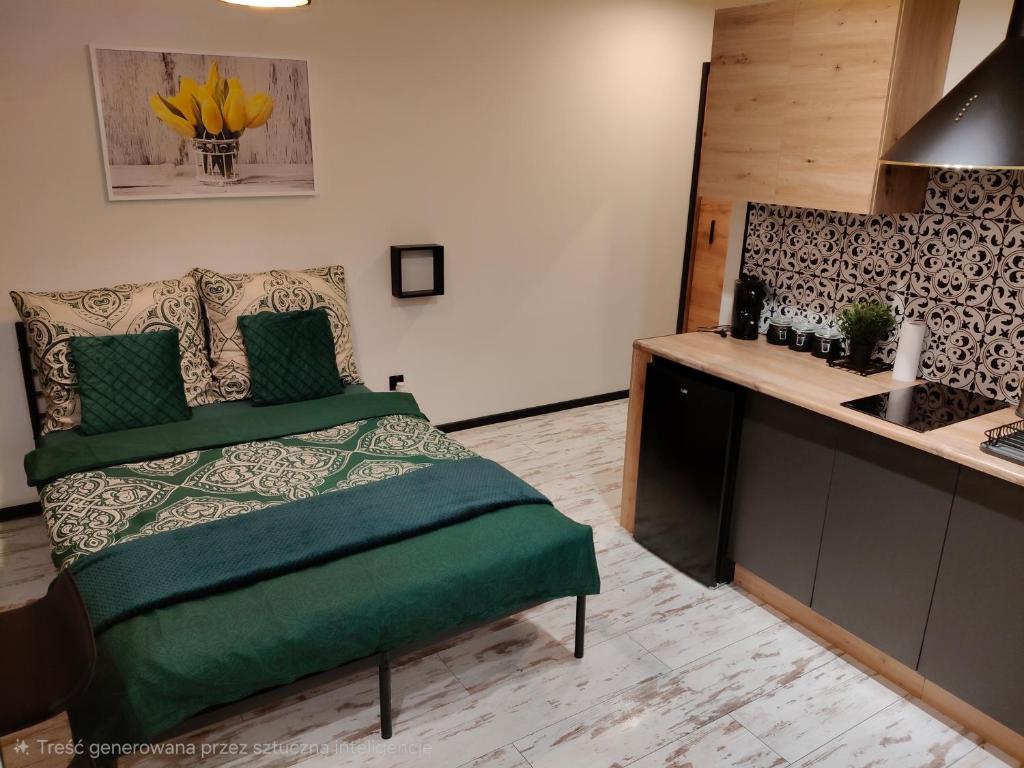 Ένα ή περισσότερα κρεβάτια σε δωμάτιο στο Apartamenty Królówka