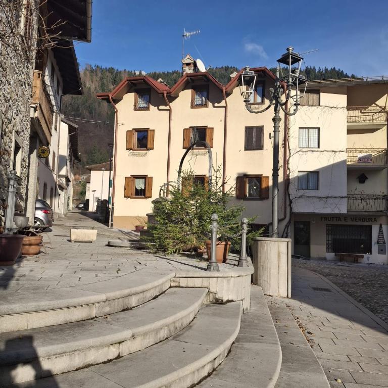 a building with steps in front of a building at La Casa dei Nonni in Arta Terme
