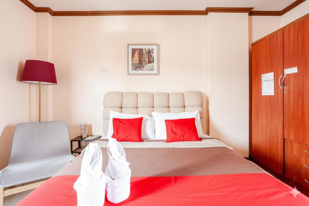 Postel nebo postele na pokoji v ubytování Suchanan Serviced Apartment สุชานันท์ เซอร์วิส อพาร์ทเม้น ระยอง