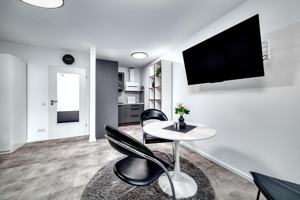 TV a/nebo společenská místnost v ubytování Feel-good apartment with balcony - quiet and central