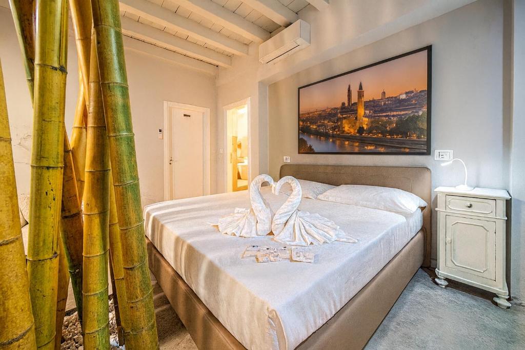 Una cama o camas en una habitación de B&B Relax Rooms - Verona Sud
