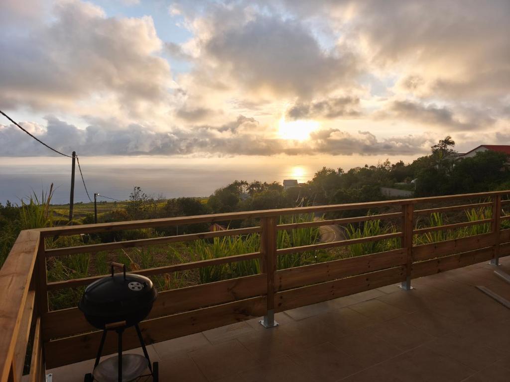 a view of the sunset from the balcony of a house at Kaz Lorizon in Petite Île