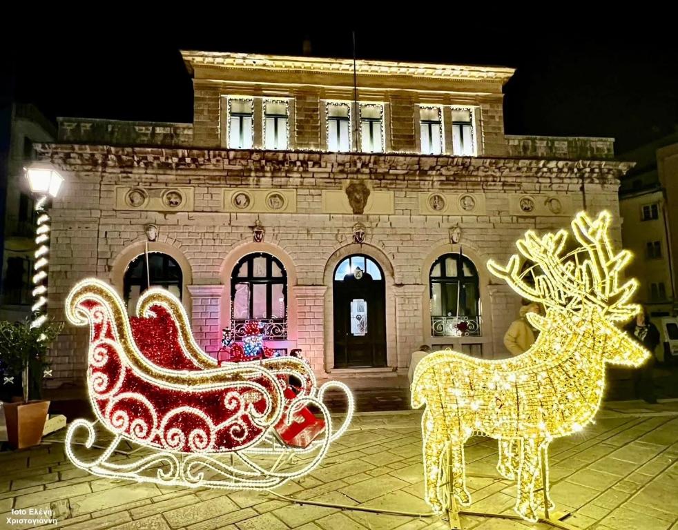 a christmas light display of a reindeer and a sleigh at Villa Maria (3) in Paleokastritsa