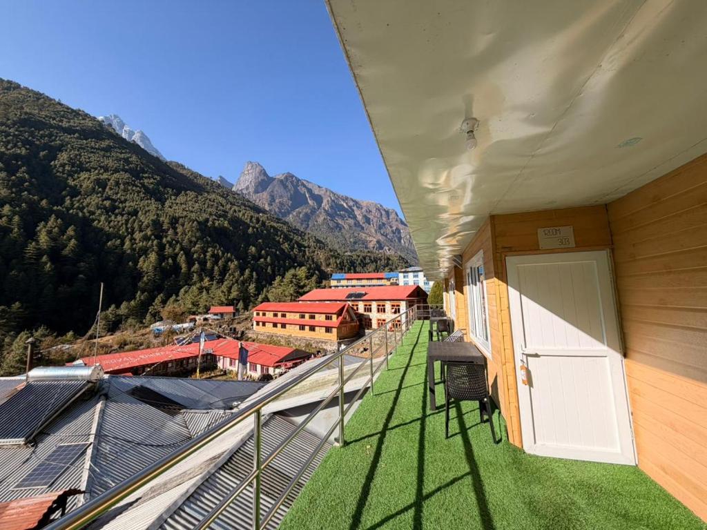 a balcony with a view of a mountain at Phakding Camp One Lodge in Phakding