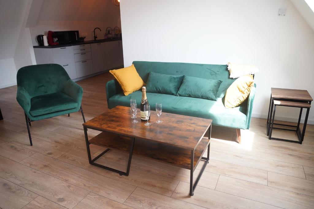 Posezení v ubytování L'appartement de la fontaine