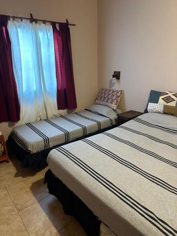 Ένα ή περισσότερα κρεβάτια σε δωμάτιο στο Departamento en Campana 2