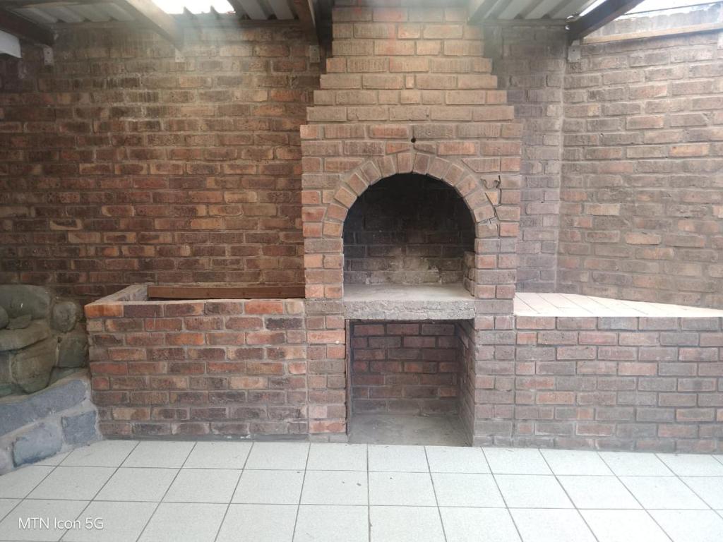 a brick oven in a brick wall at Quigney House on 66 Rhodes in East London