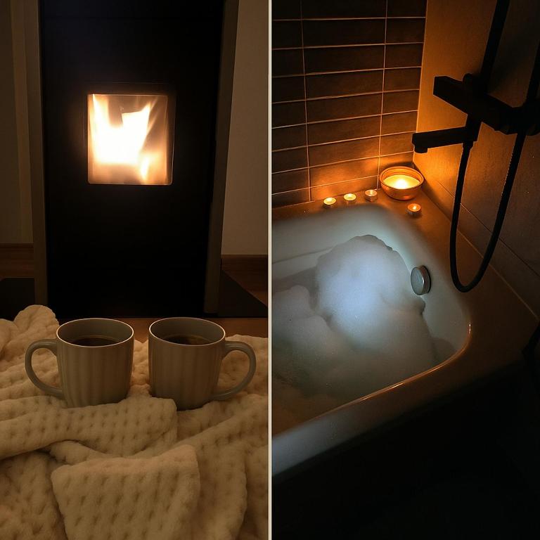 a bathtub with two cups of coffee and two towels at Apartament z kominkiem w starej kamiennicy in Przygórze