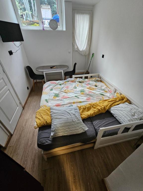 Ένα ή περισσότερα κρεβάτια σε δωμάτιο στο l 'escapade amiénoise 2