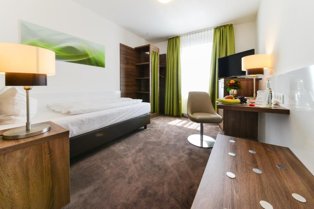 Postel nebo postele na pokoji v ubytování Hotel Günter