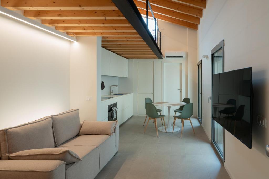 a living room with a couch and a table at Sarius Relais in Seriate