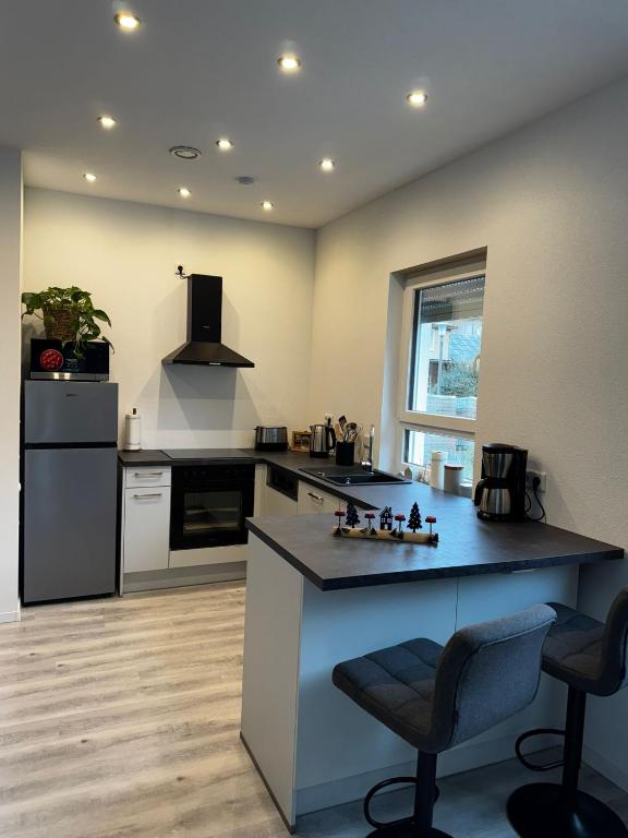 a kitchen with a large island in a room at Ferienhaus Moritz in Ippesheim