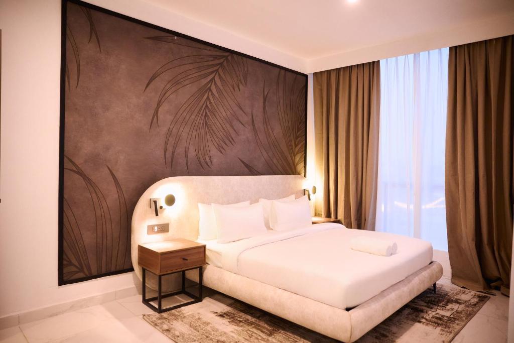 Giường trong phòng chung tại Azusa Hotel and Apartments