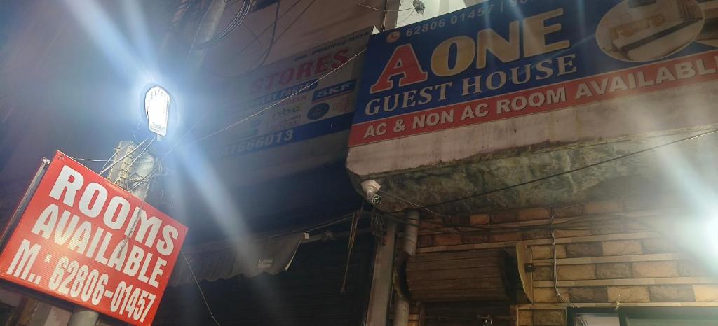 a building with signs on the side of it at A One Guest House in Jalandhar