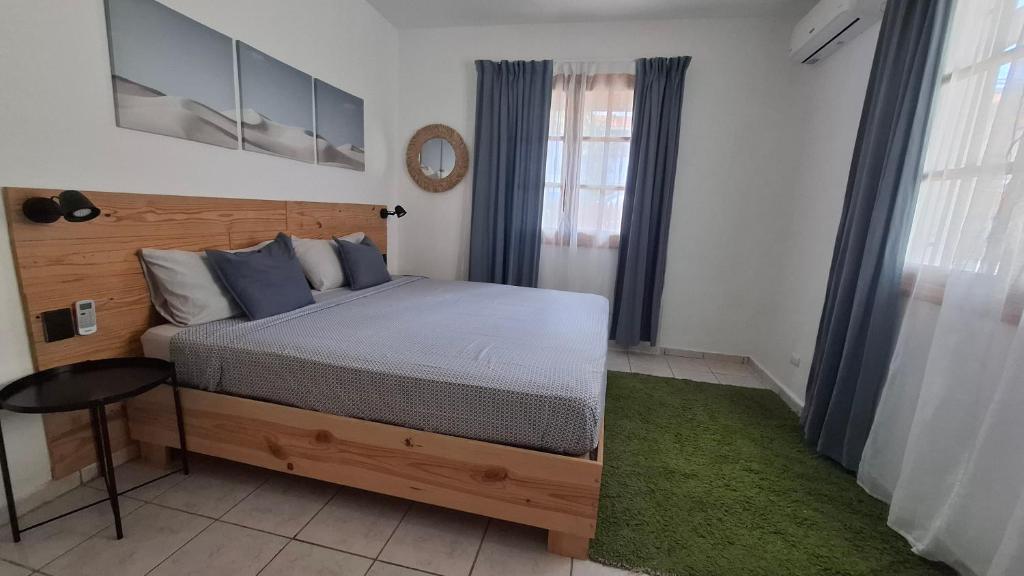 Ένα ή περισσότερα κρεβάτια σε δωμάτιο στο Serenity Dominicus