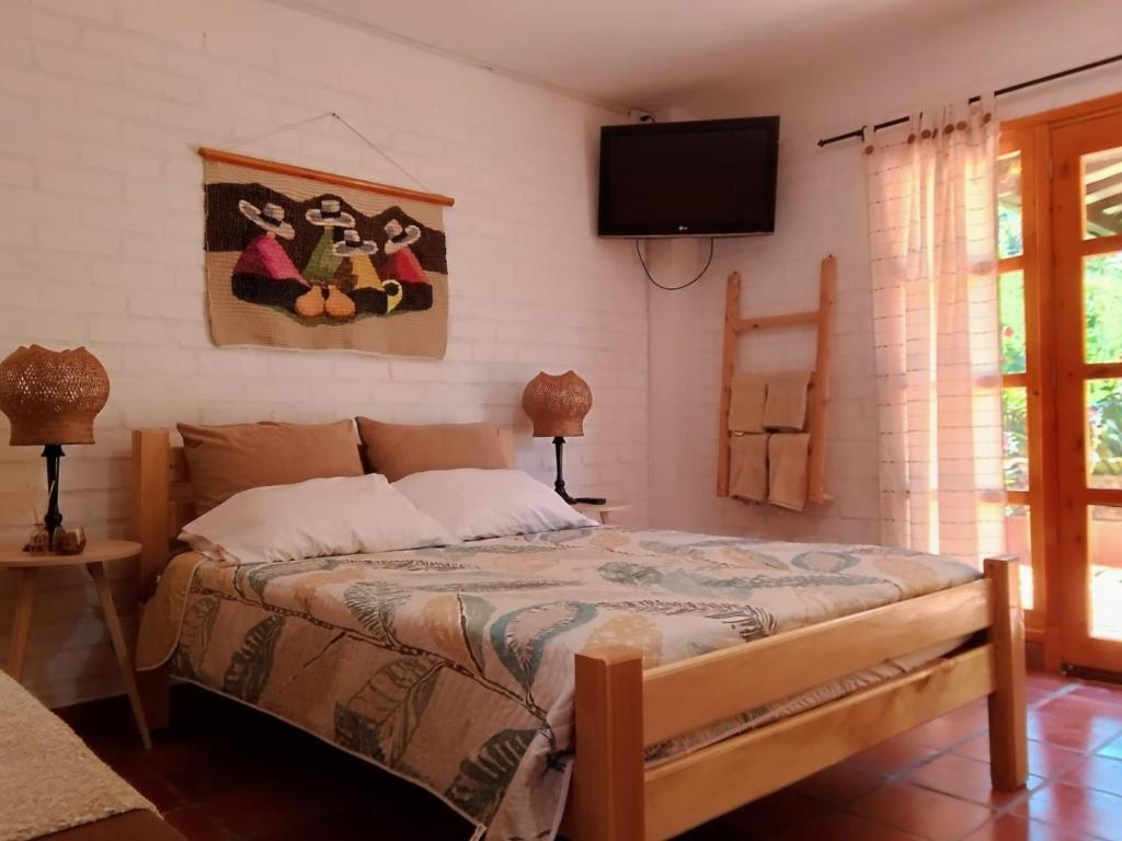 Giường trong phòng chung tại villa luz de vida