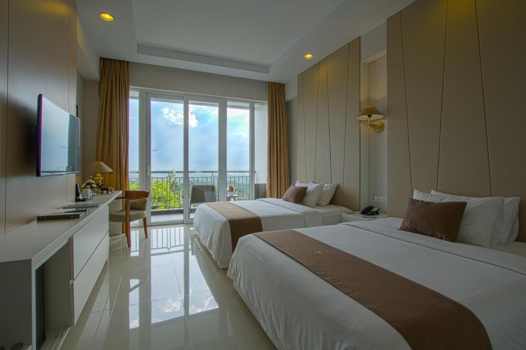 A bed or beds in a room at R Hotel Rancamaya