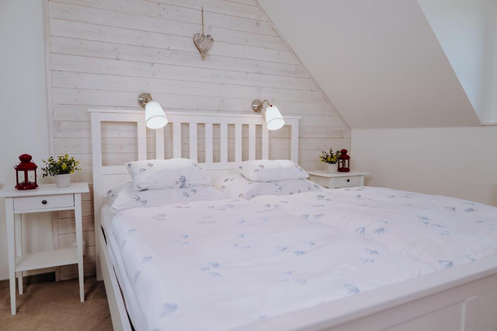 Una cama o camas en una habitación de Srdeční záležitost Boží Dar