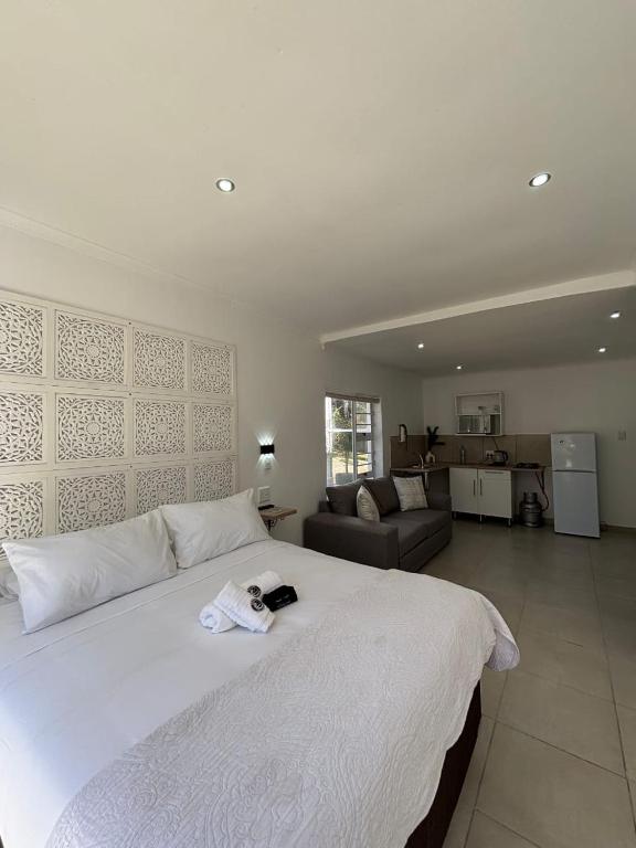 Postel nebo postele na pokoji v ubytování Seven on Cooper