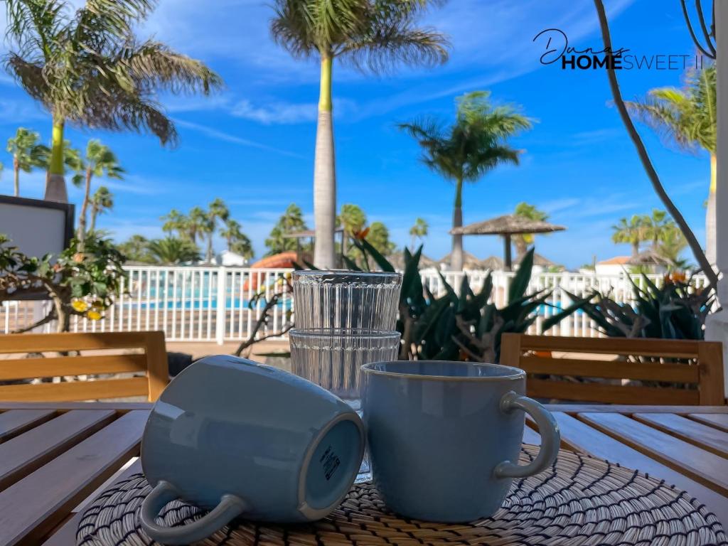 a table with a coffee maker and a cup on it at Oasis Dunas Sweet Family Home II Pool view by B-Rent in Corralejo