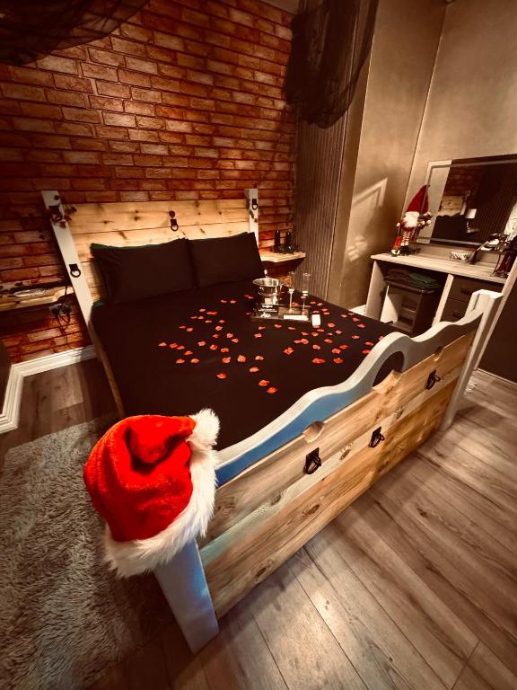a bedroom with a bed with a santa hat on it at The Alchemy in Bournemouth